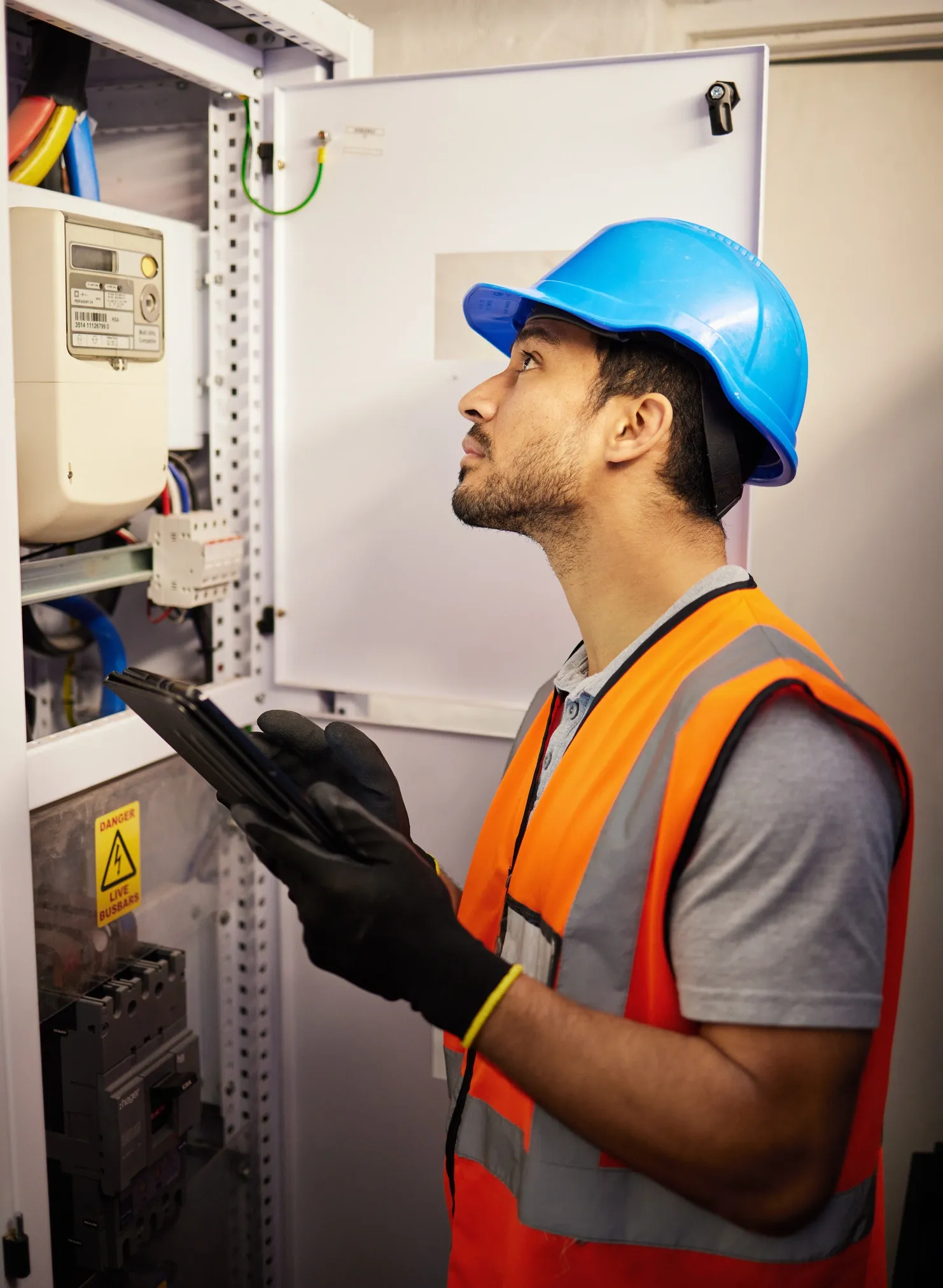 Electrical technician working on commercial equipment